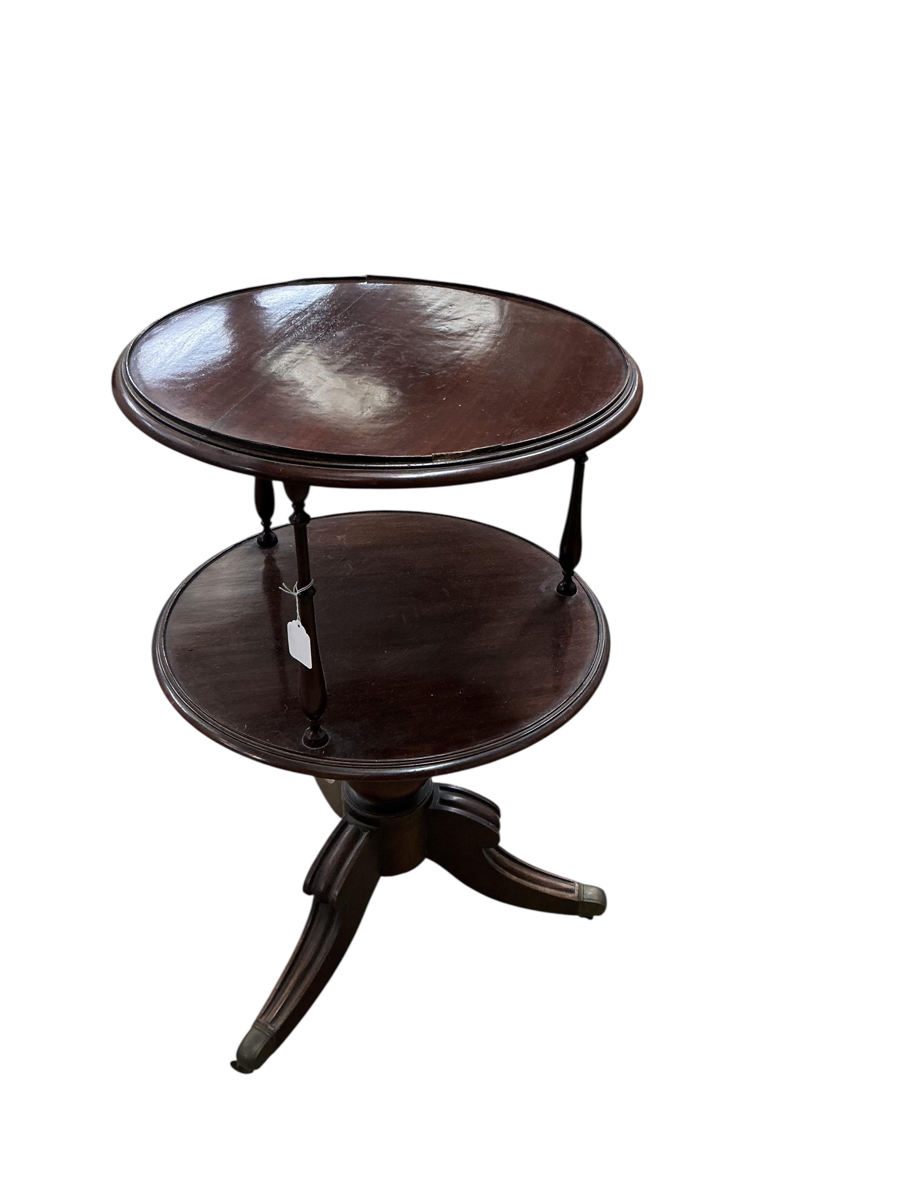 An early 20th century circular mahogany two tier whatnot, diameter 60cm, height 98cm